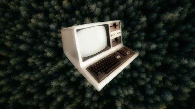 Ordinateur des années 1970 face à une canopée vue du ciel